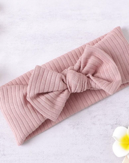 Hårbandet LUCIA  med rosett i ekologisk bomull